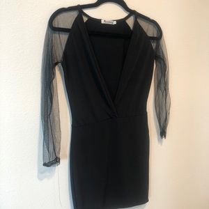 Plunging neckline dress with sheer shoulders